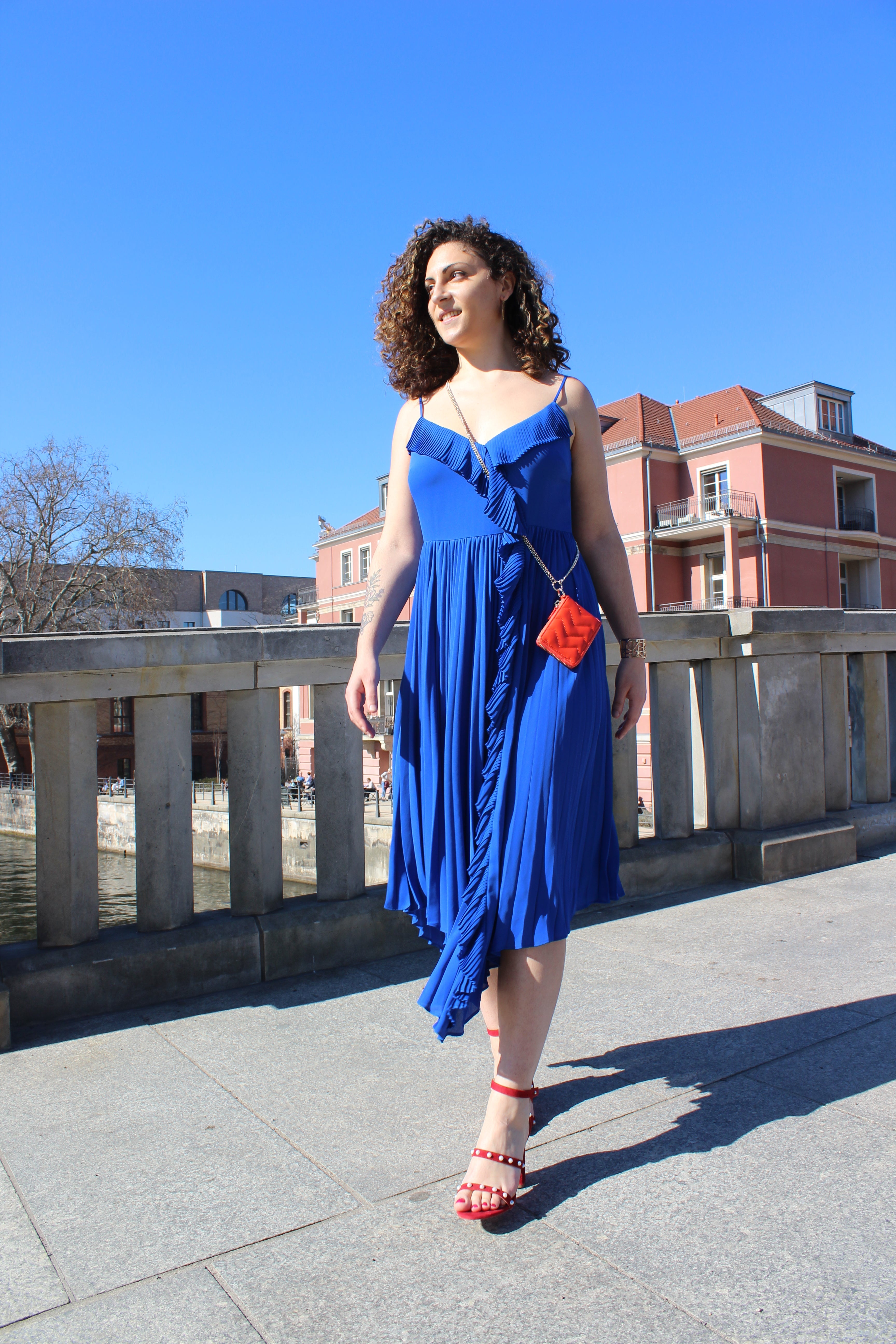 BLUE PLEATED DRESS WITH VOLANTS