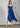 BLUE PLEATED DRESS WITH VOLANTS